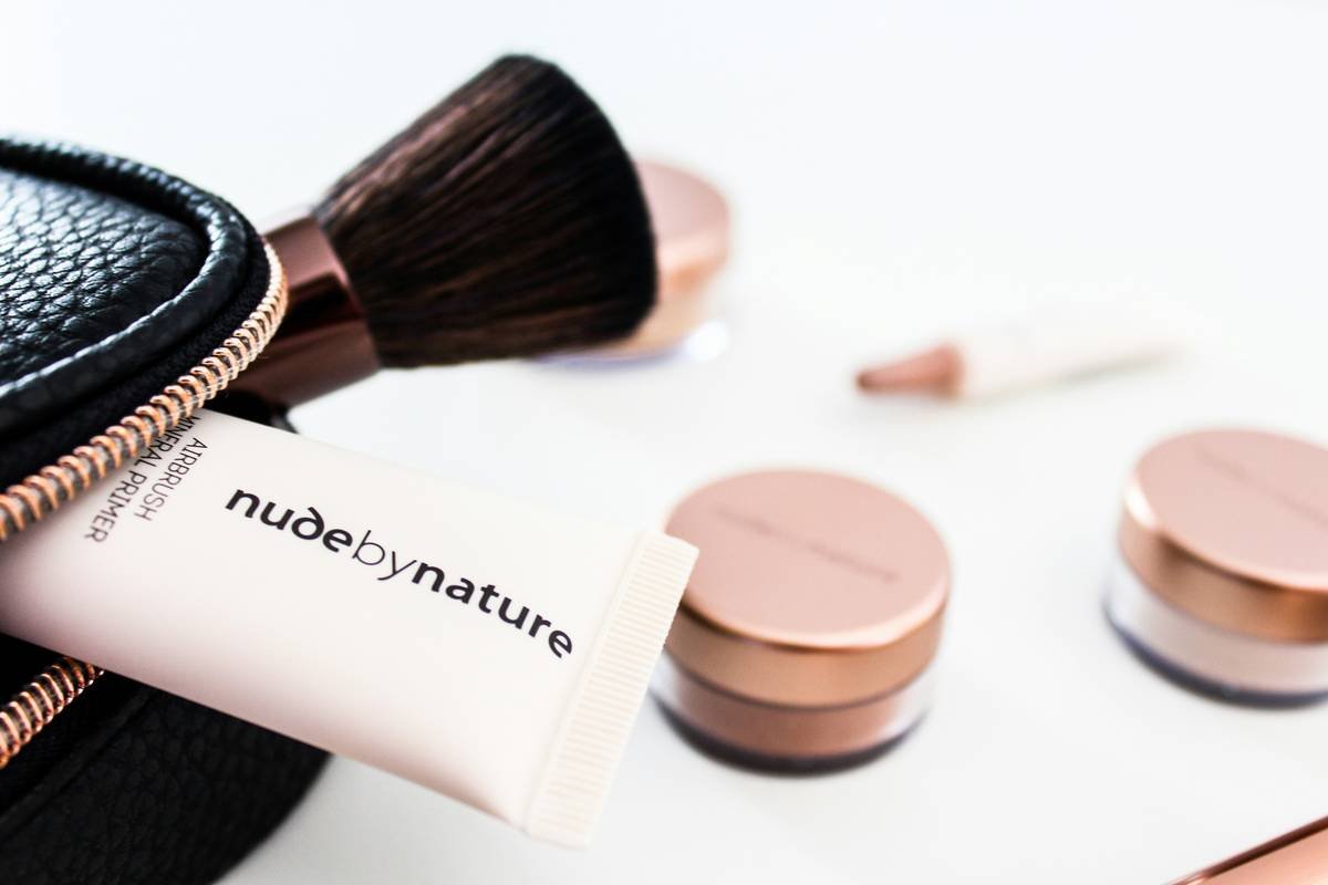 Infographic comparing ingredient lists of foundation vs. skincare-focused tinted moisturizer showing hyaluronic acid, ceramides, and non-nano zinc oxide in the latter